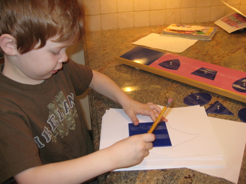 Henry, 6, doing pre-handwriting exercises.