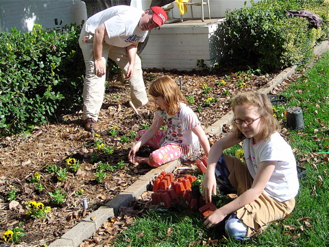 matt-and-girls-planting-flowers