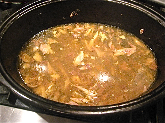 broth in bottom of roasting pan